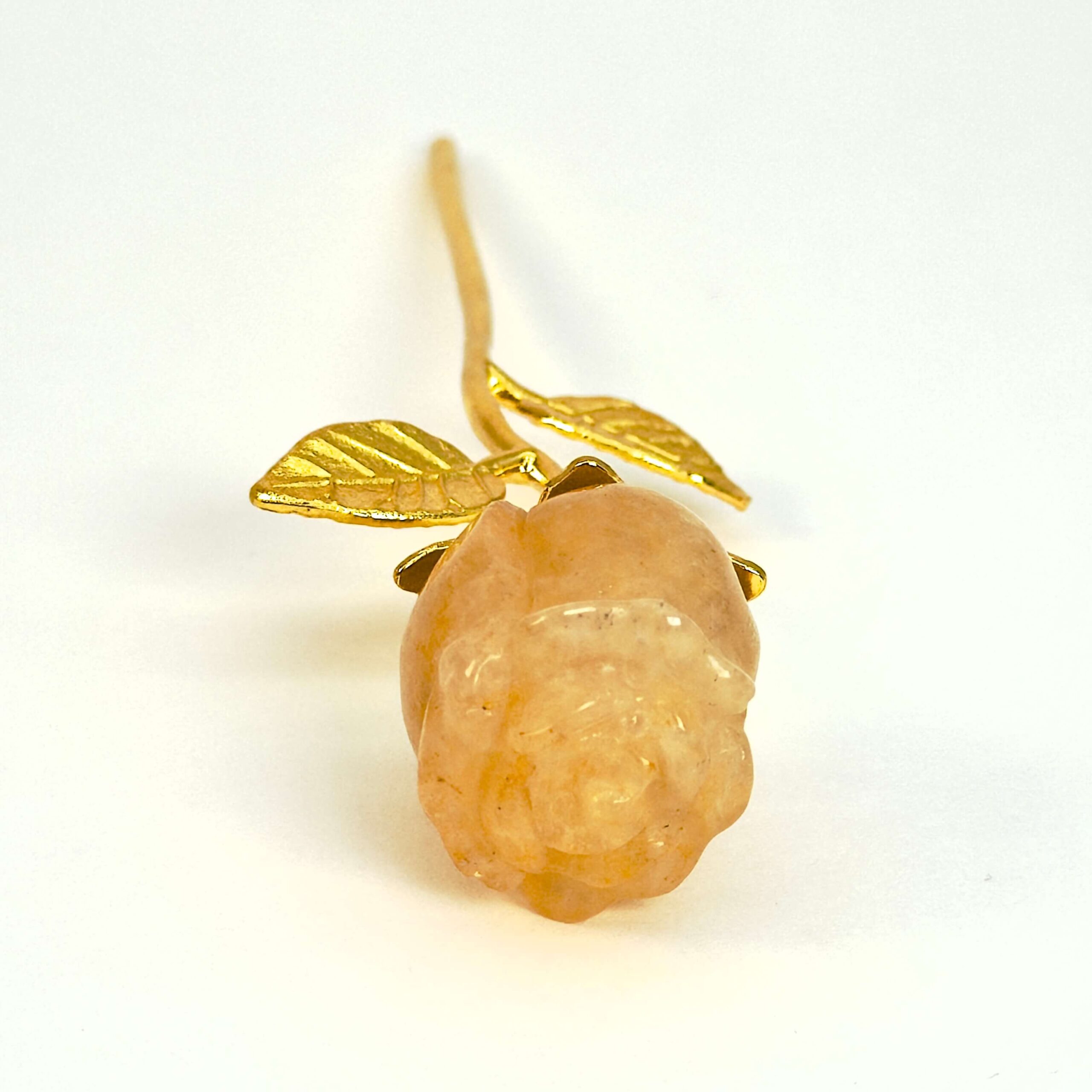 Golden Healer Rose med guldfarvet stilk krystal sten på hvid baggrund