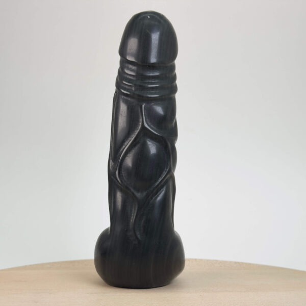 Sort obsidian sølv penis med glimtende sølvreflektioner